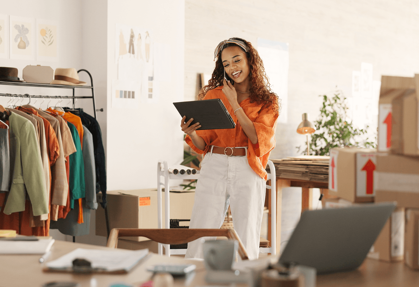 woman smiling on the phone and looking at table